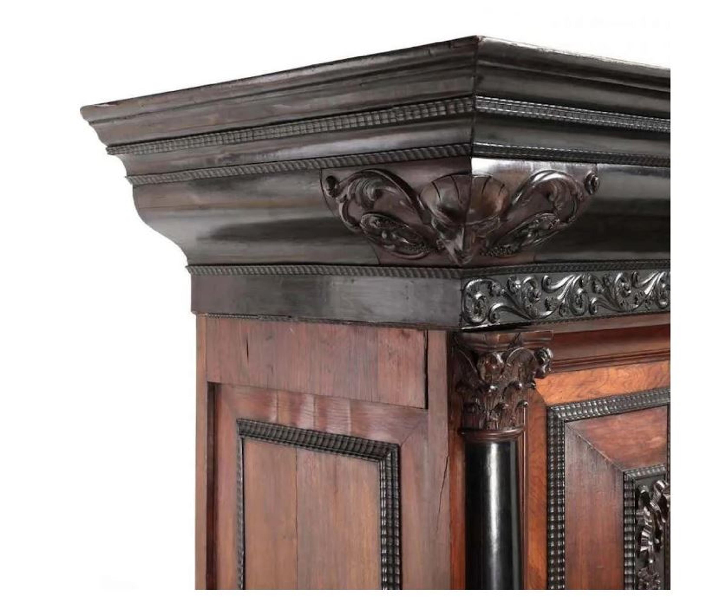 A Flemish Part-Ebonized Carved Rosewood Armoire — 17TH/18TH CENTURY