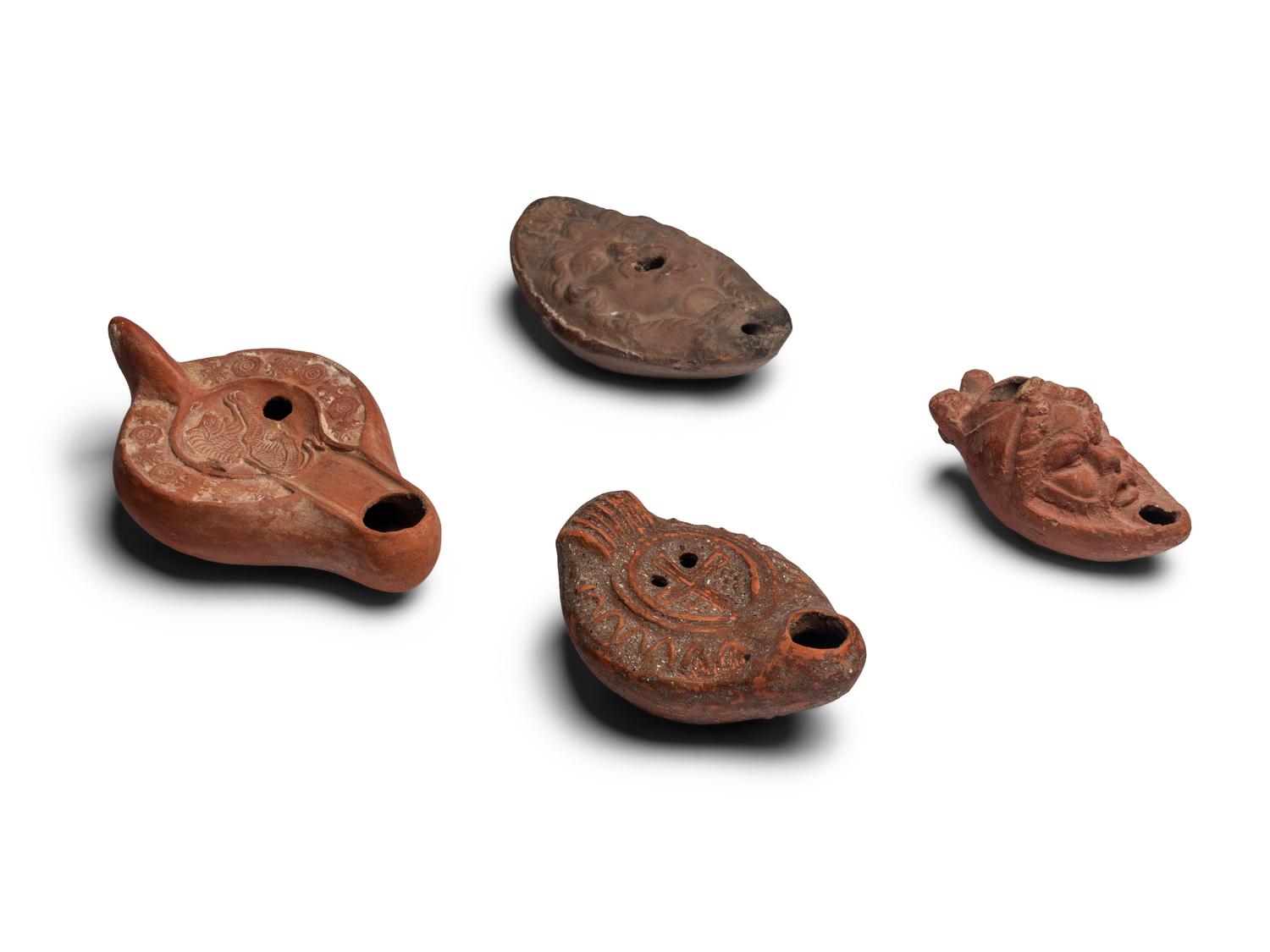 Four Roman Terracotta Oil Lamps