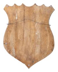 A Folk Art Carved and Painted Shield Form Flag