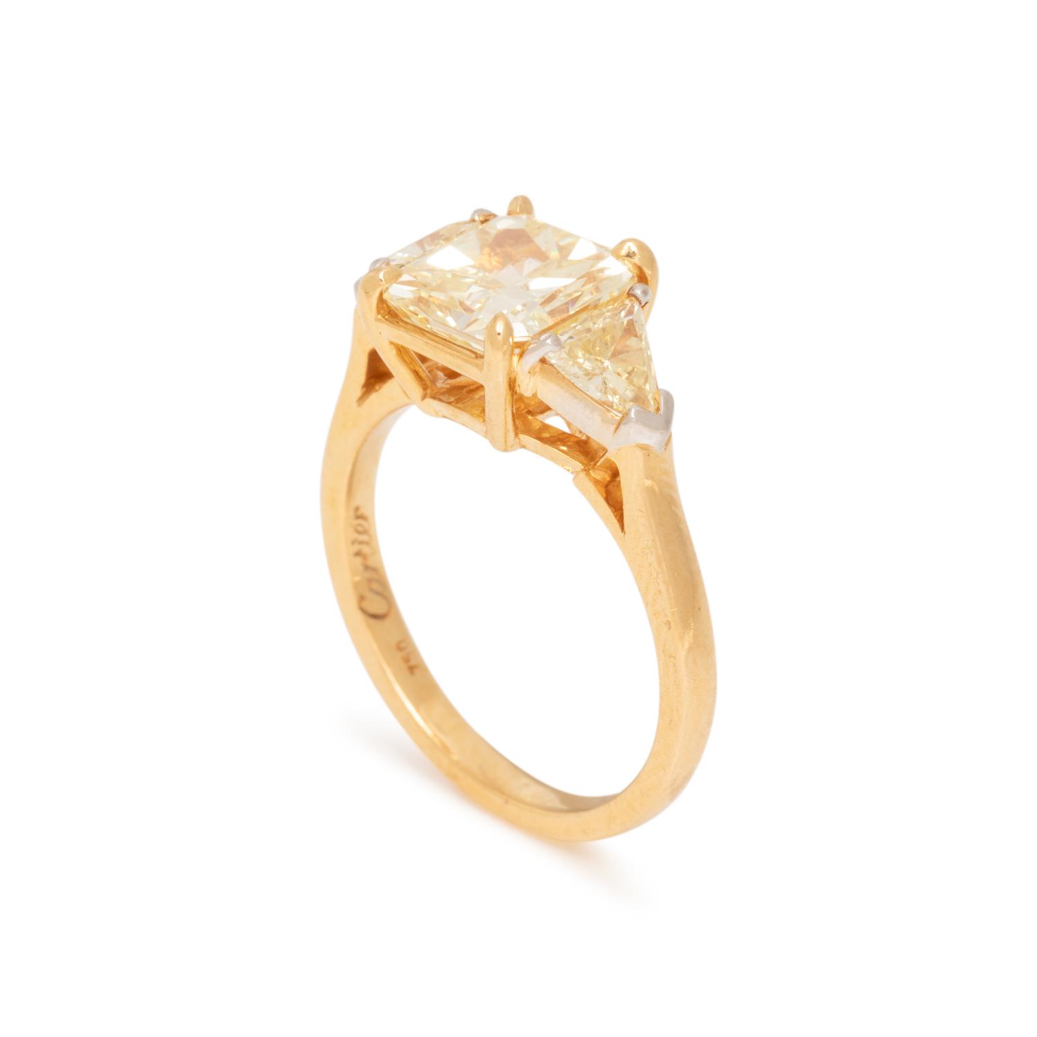 CARTIER, FANCY LIGHT YELLOW DIAMOND AND COLORED DIAMOND RING
