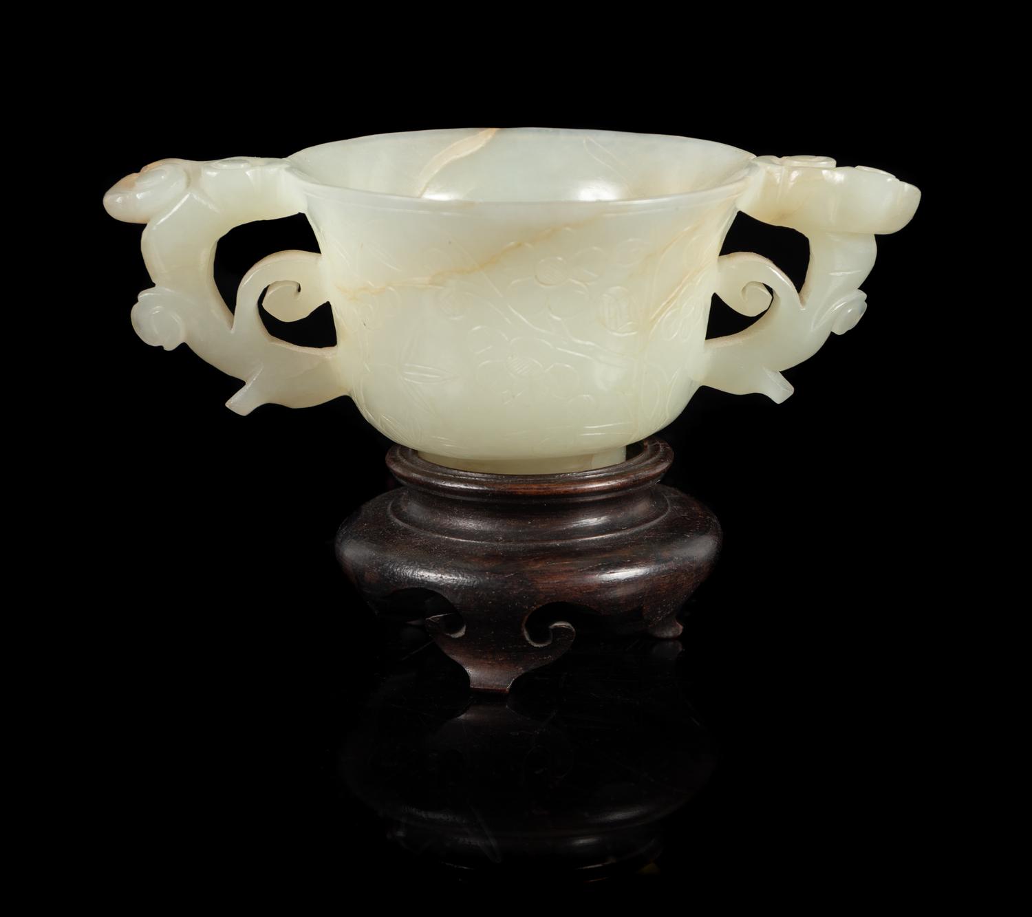 A White Jade Double Handled Cup Length 4 7/8 inches. — 19TH/20TH CENTURY