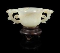 A White Jade Double Handled Cup Length 4 7/8 inches. — 19TH/20TH CENTURY