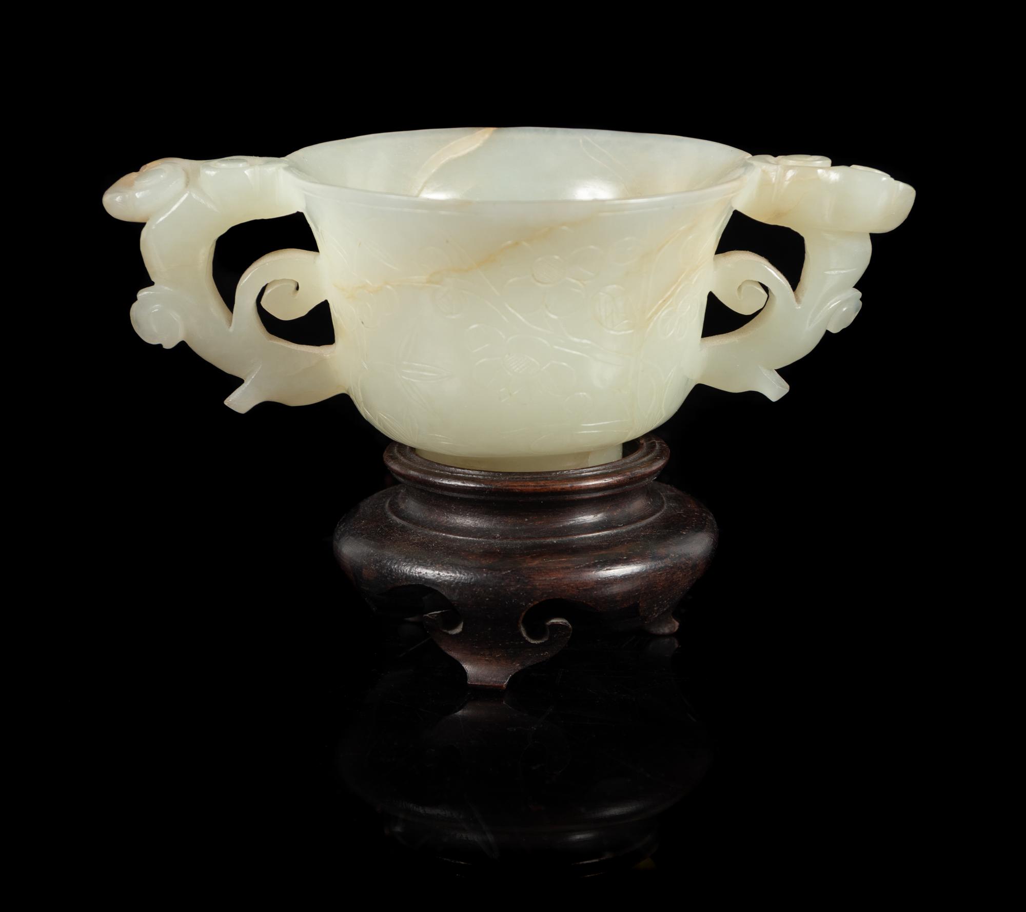 A White Jade Double Handled Cup Length 4 7/8 inches. — 19TH/20TH CENTURY