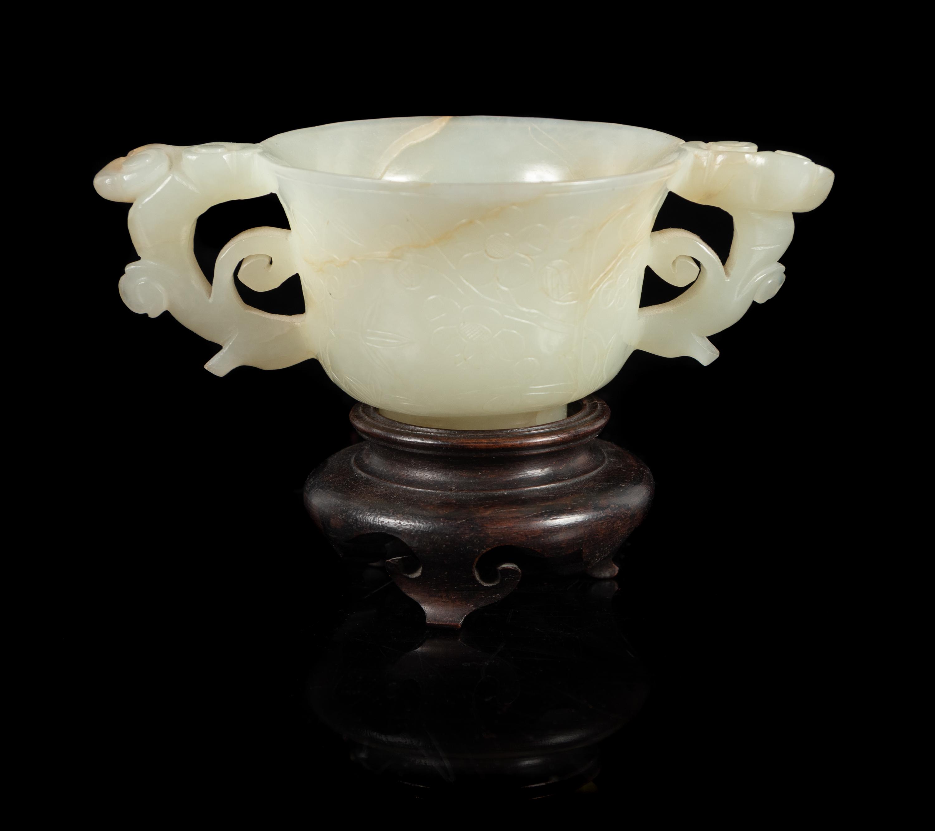 A White Jade Double Handled Cup Length 4 7/8 inches. — 19TH/20TH CENTURY