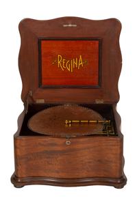 A Regina Mahogany Serpentine Cabinet Music Box