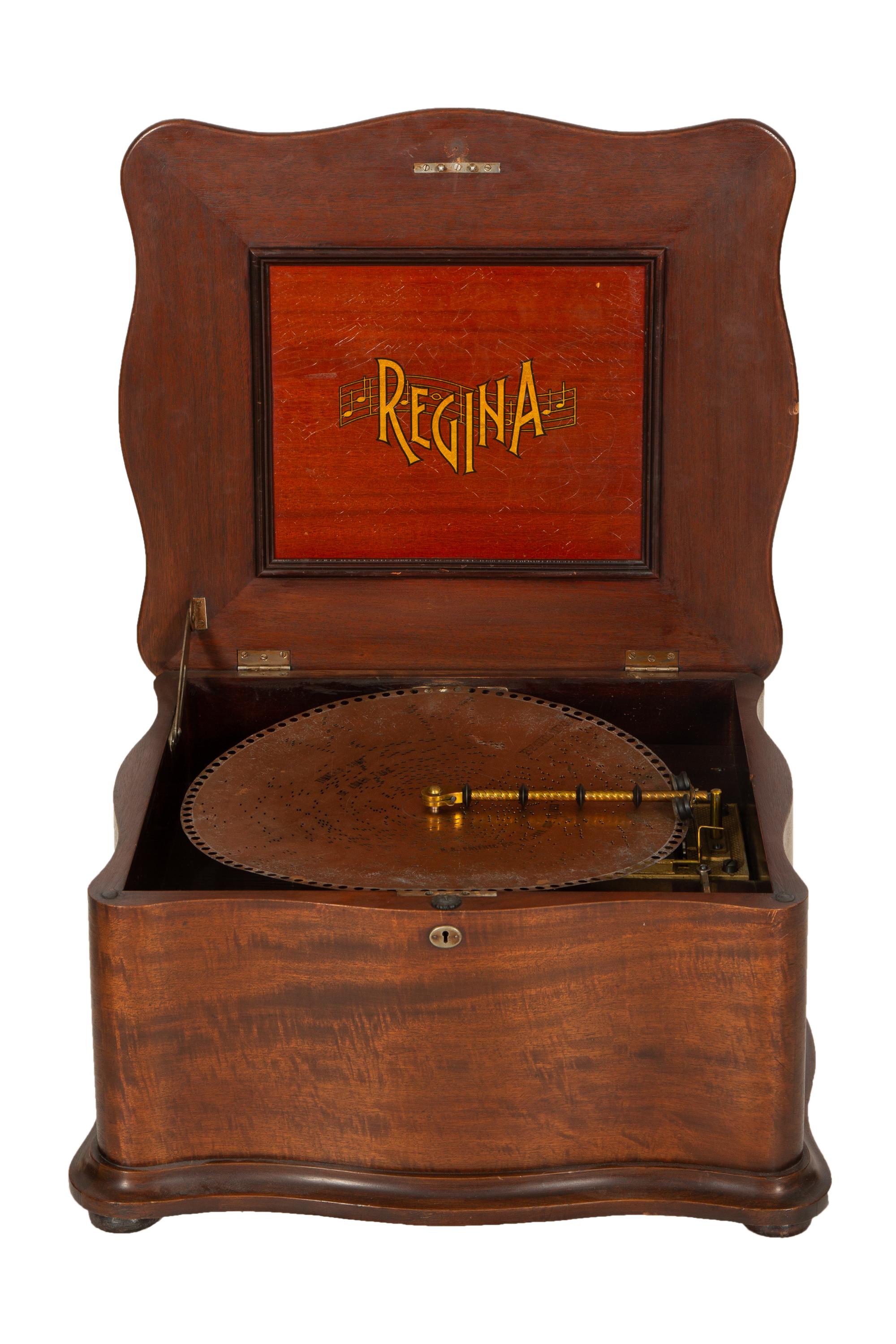 A Regina Mahogany Serpentine Cabinet Music Box