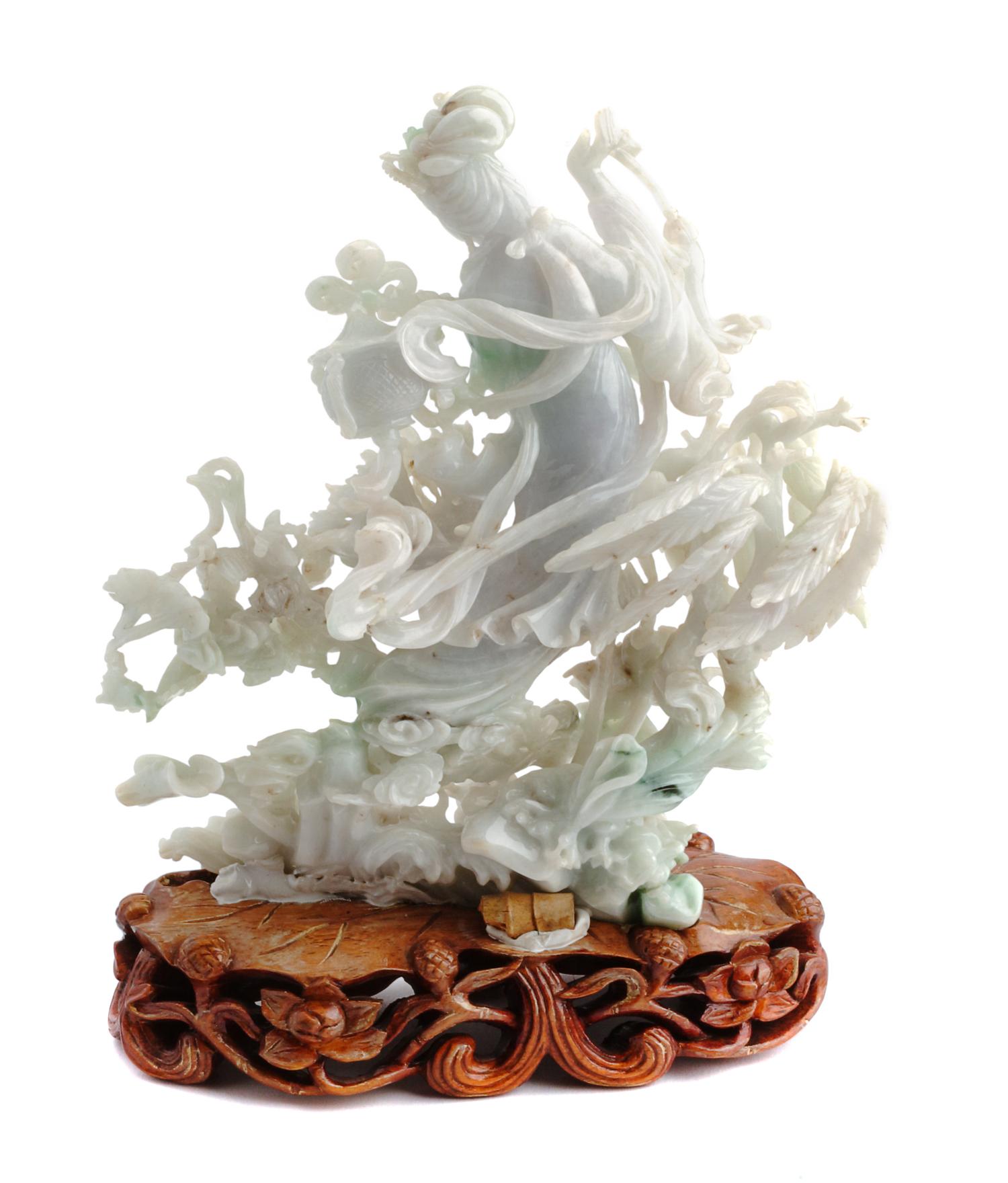 A Chinese Carved Jadeite Figure Height 7 inches.