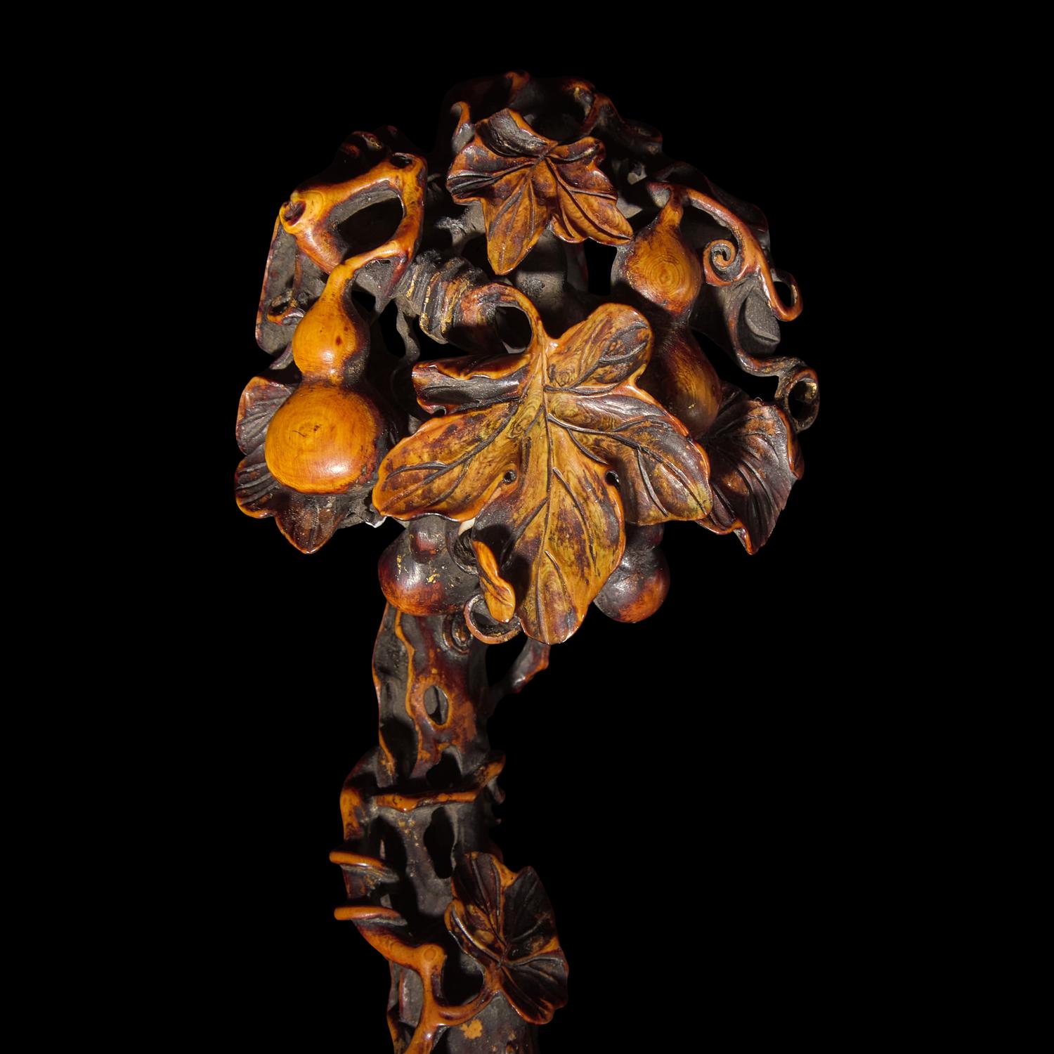 A Chinese Finely Carved Stained Bone Ruyi Scepter, Qing Dynasty — 清 木“福祿萬代”如意
