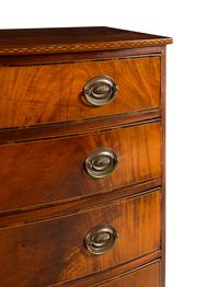 A Federal Inlaid and Figured Mahogany Bow-Front Chest of Drawers