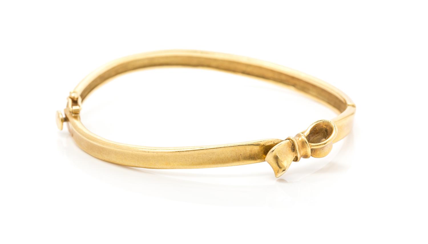 An 18 Karat Yellow Gold Bow Motif Bangle, Angela Cummings, Circa 1984, 12.10 dwts.