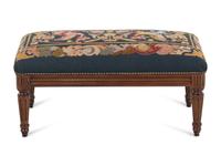 A Louis XVI Style Walnut Bench with a Needlepoint Seat