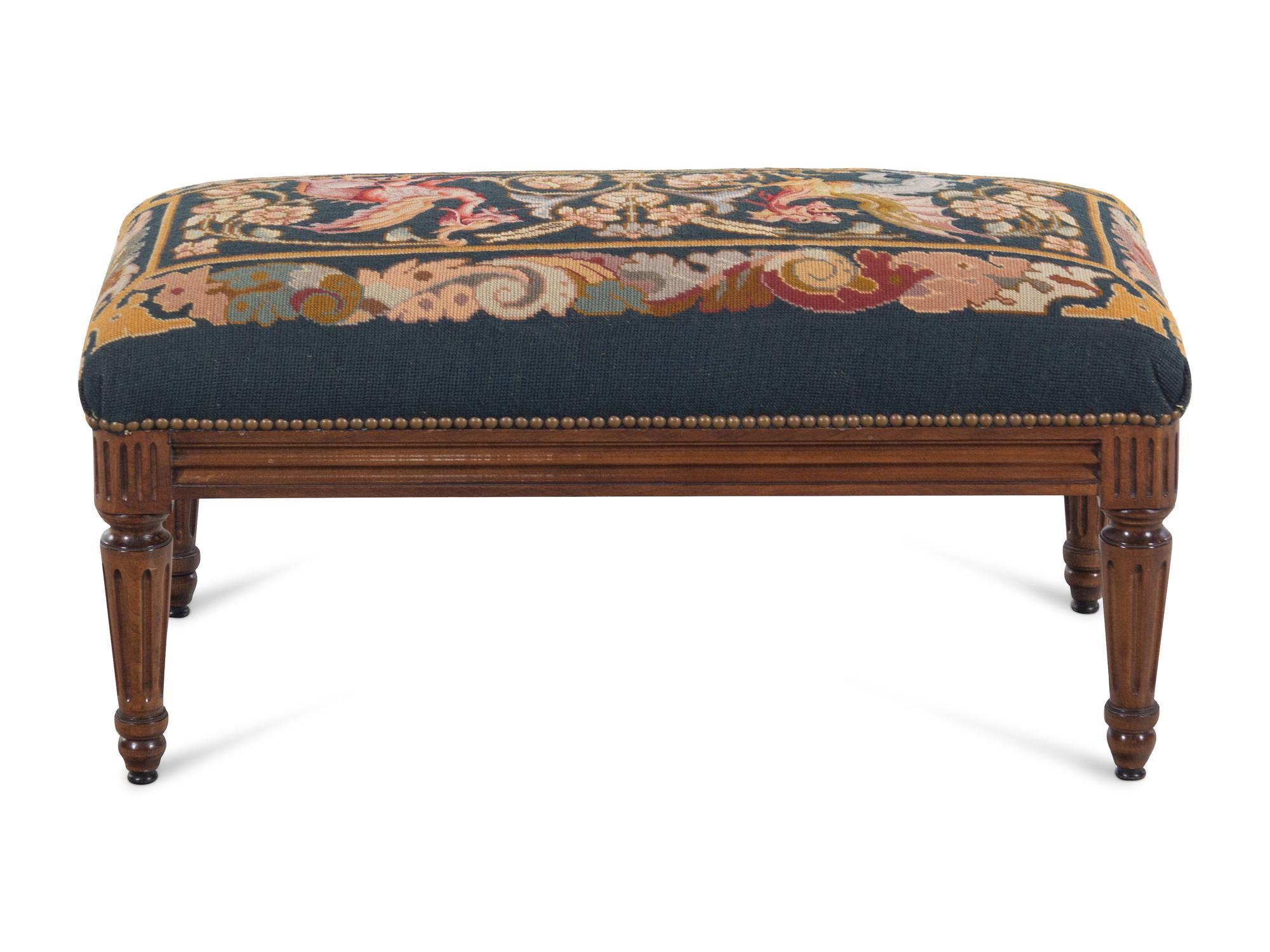 A Louis XVI Style Walnut Bench with a Needlepoint Seat