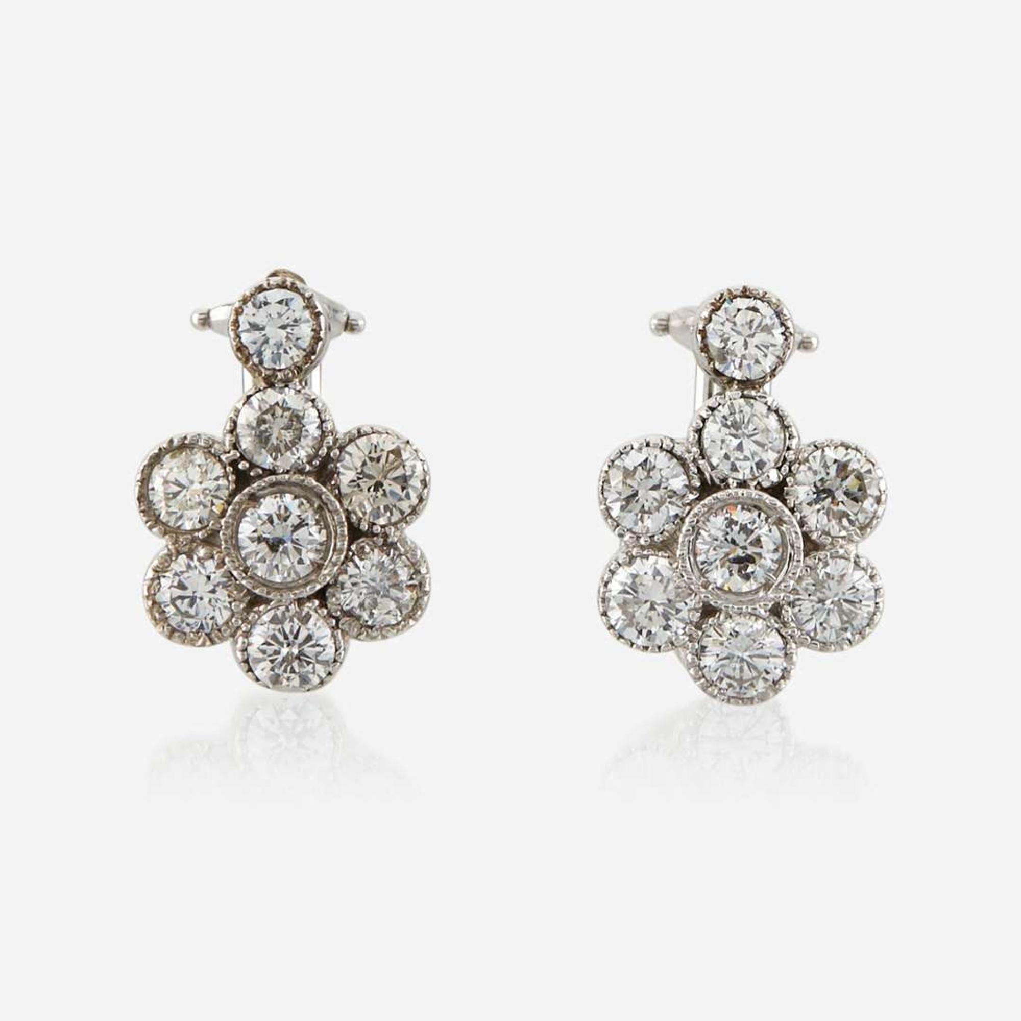 A pair of diamond and white gold earrings