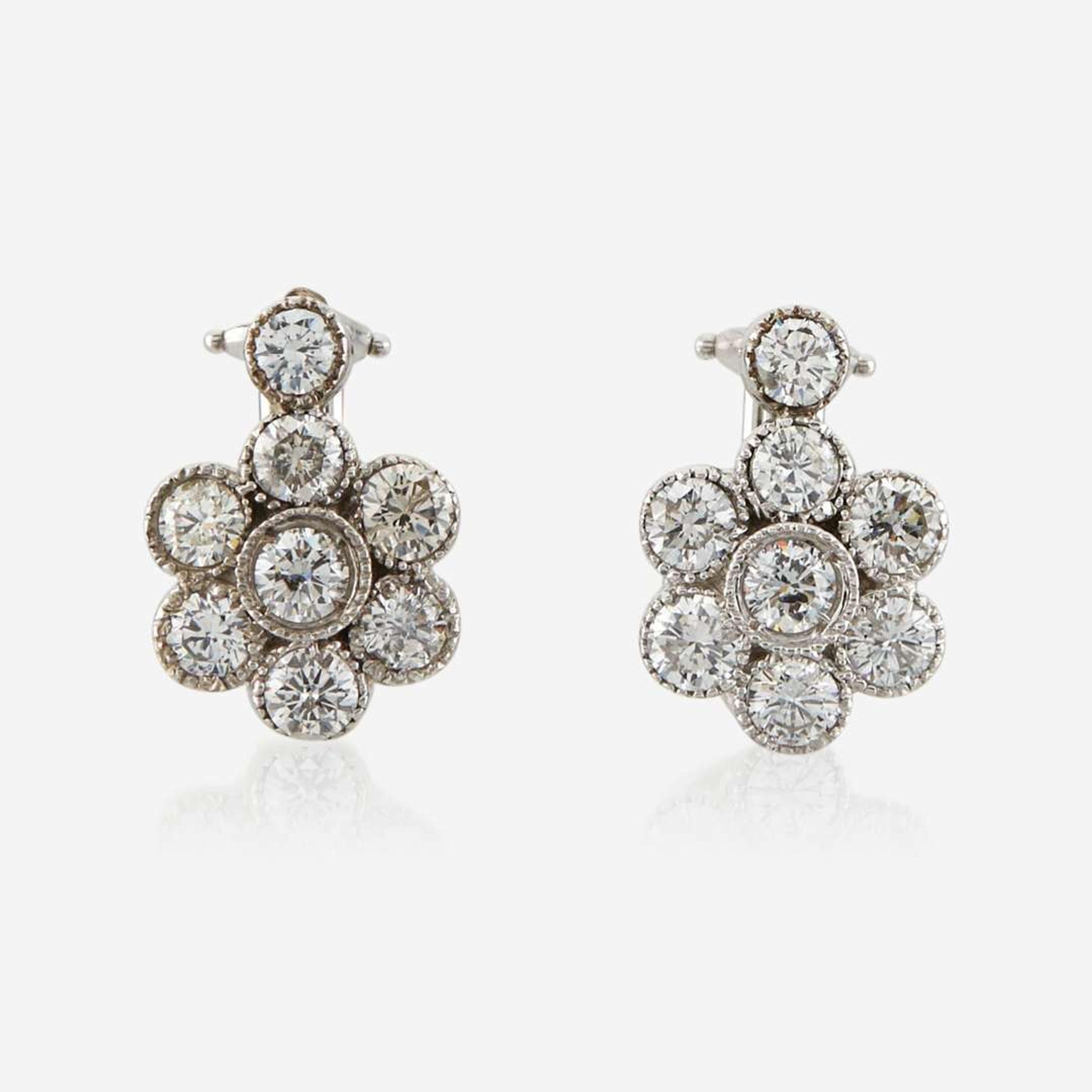 A pair of diamond and white gold earrings