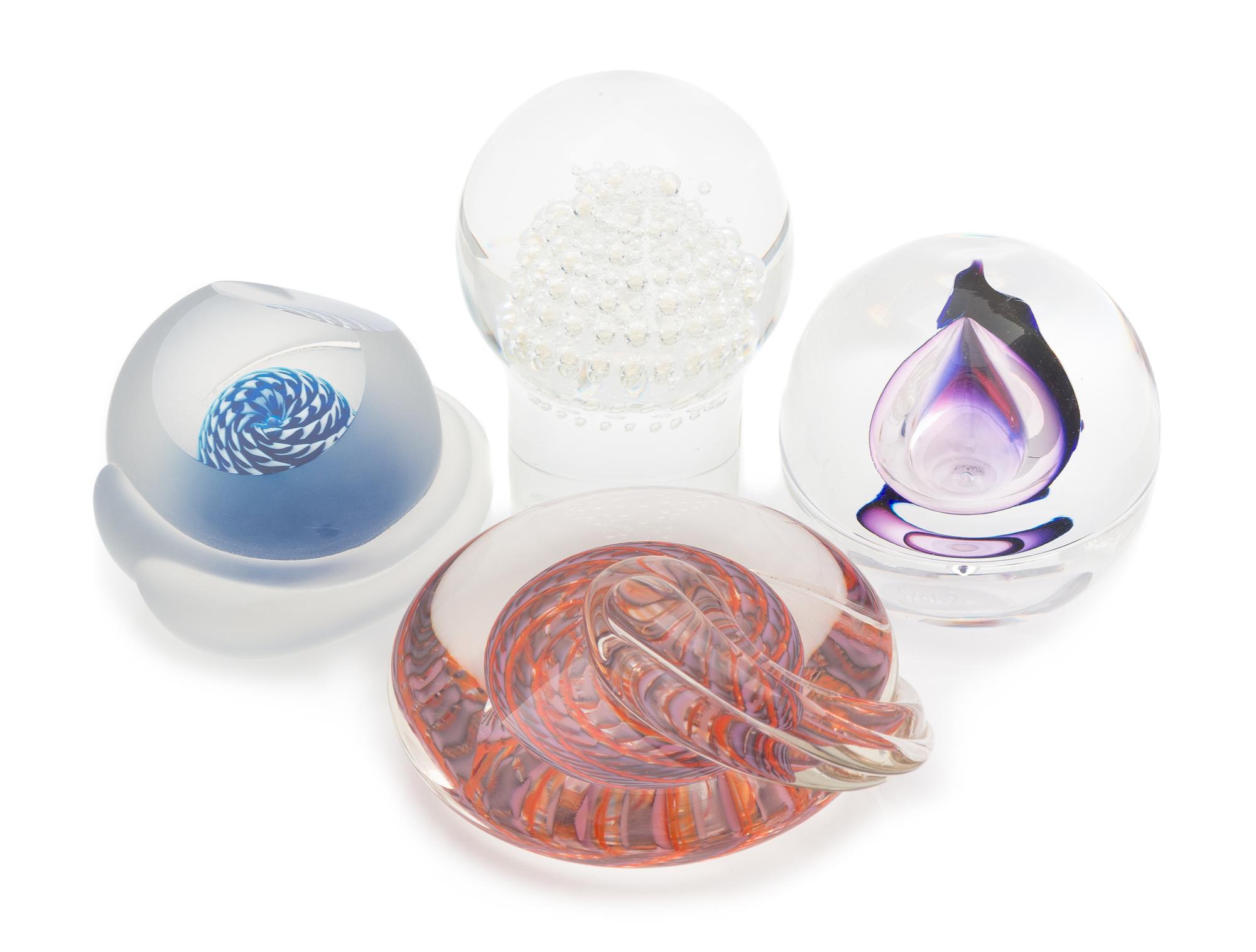 Susan DiMarchi and Kosta Boda, a group of four glass paperweights