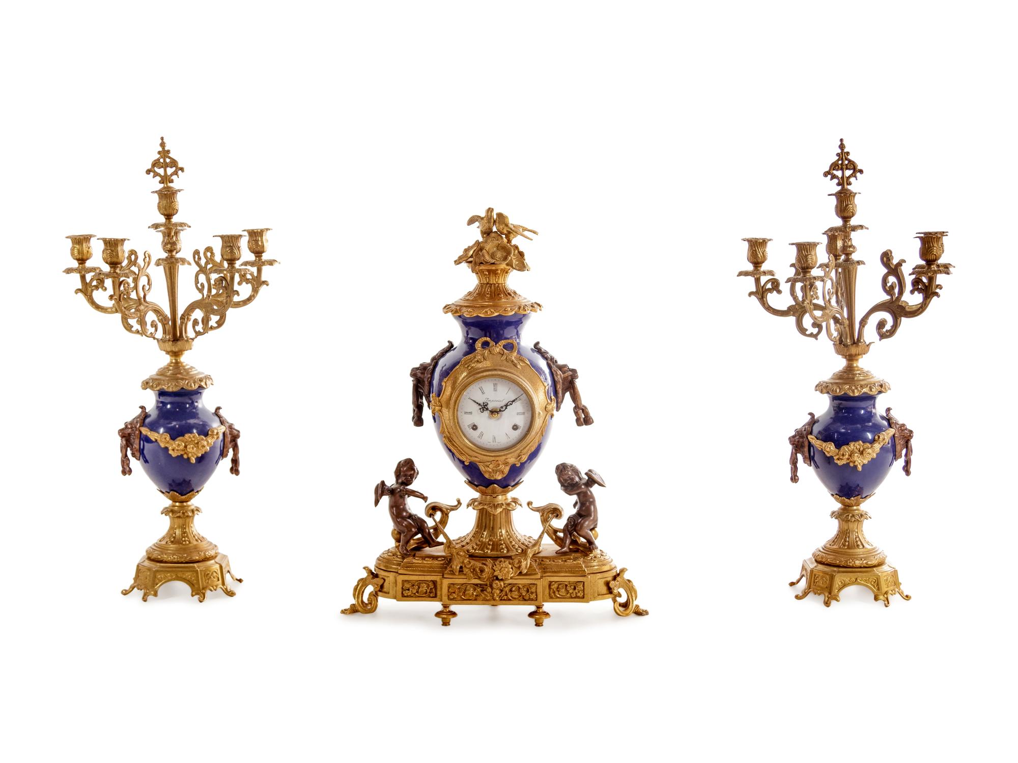 A Napoleon III Style Gilt Bronze Mounted Cobalt Porcelain Clock Garniture