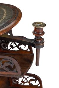 A William IV Mahogany Revolving Book Stand with Candle Branch