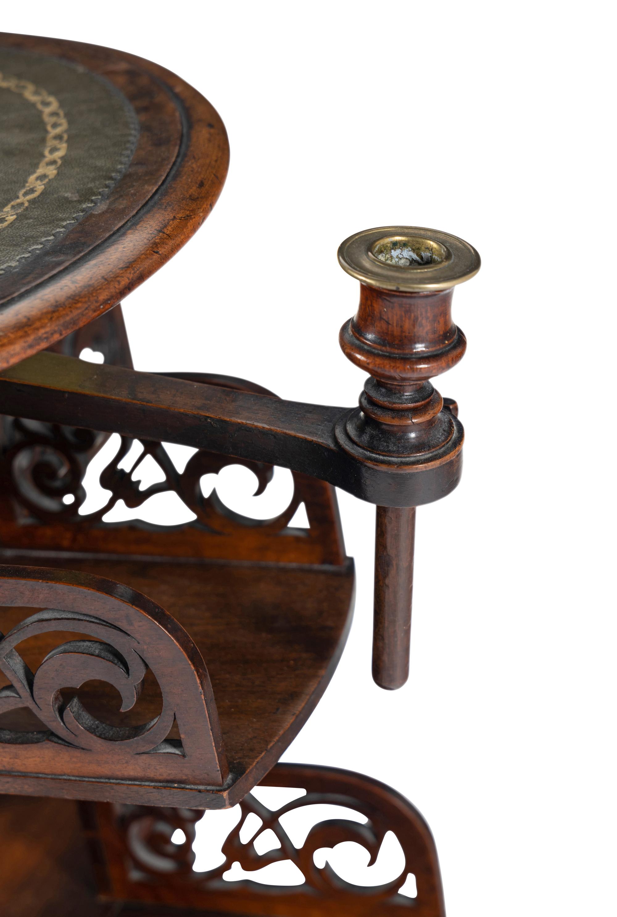 A William IV Mahogany Revolving Book Stand with Candle Branch