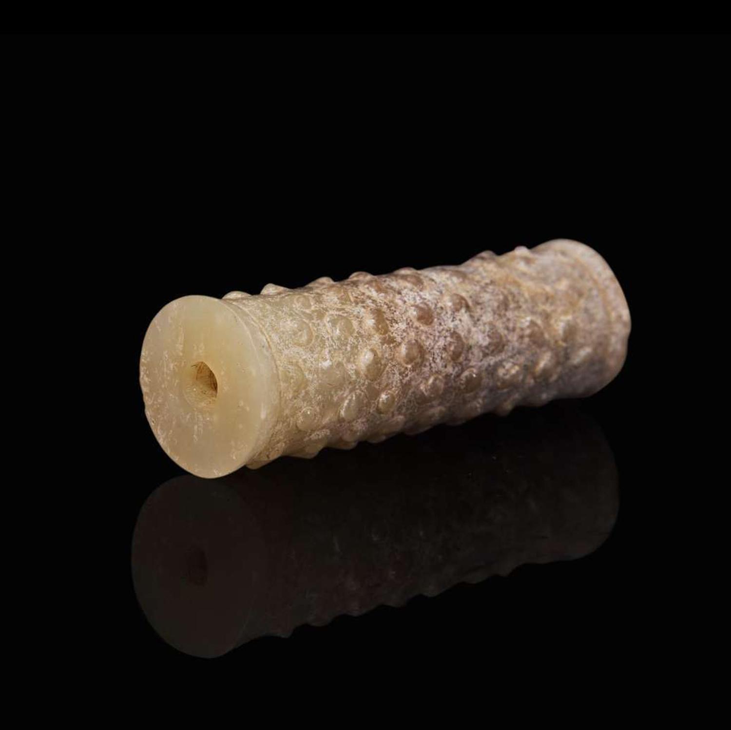 An assembled set of two small Chinese jade bi discs and a jade tube, Warring State period 戰國 玉系璧兩件及玉勒子一