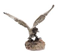 An Italian Silver Model of an Eagle, Manner of Buccellati, Florence, 20th Century, with outstretched wings, on a rock base.