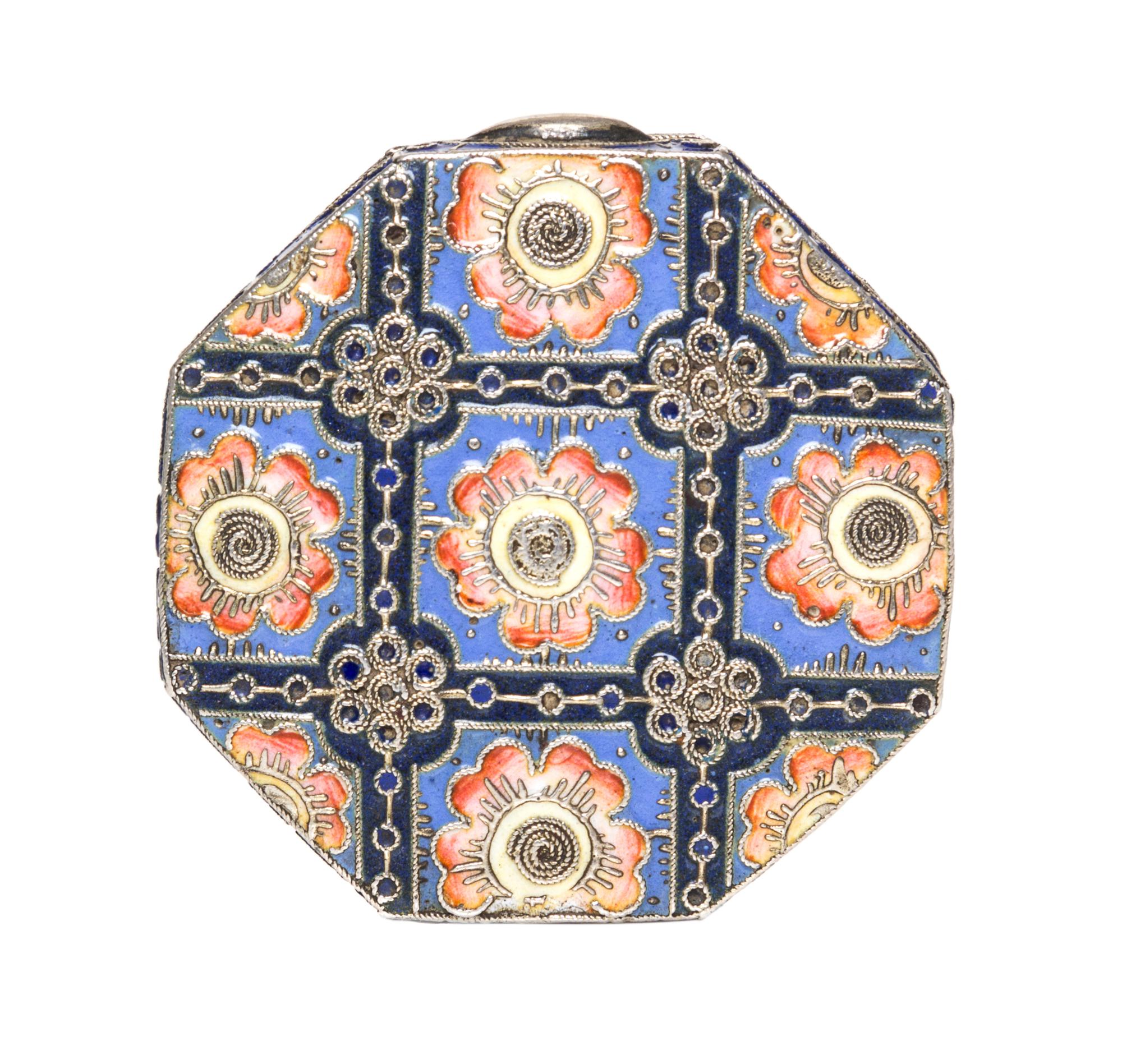 A Russian Enameled Silver Pill Box, 11th Artel, Moscow, 1908-1926, of octagonal fom with polychrome floral decoration.