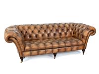 A Brown Leather Upholstered Chesterfield Sofa — 20TH CENTURY