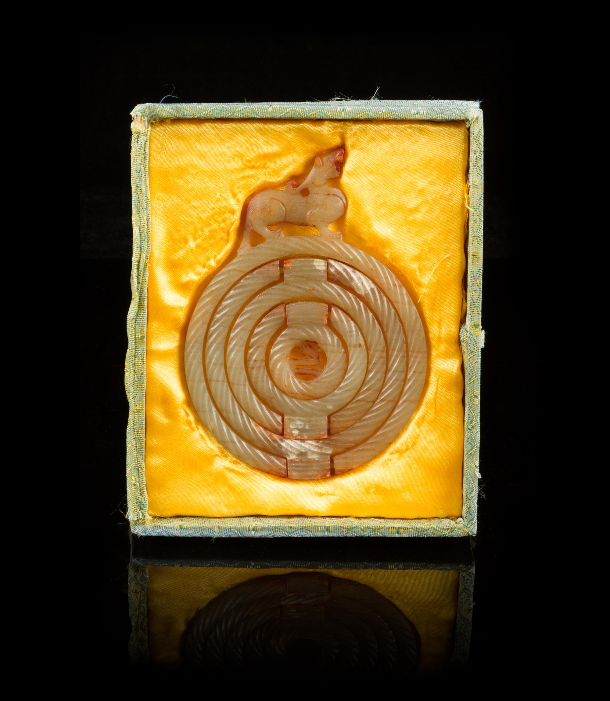 A Group of Seven Carved Jade Bi Discs Diameter of largest 9 inches.