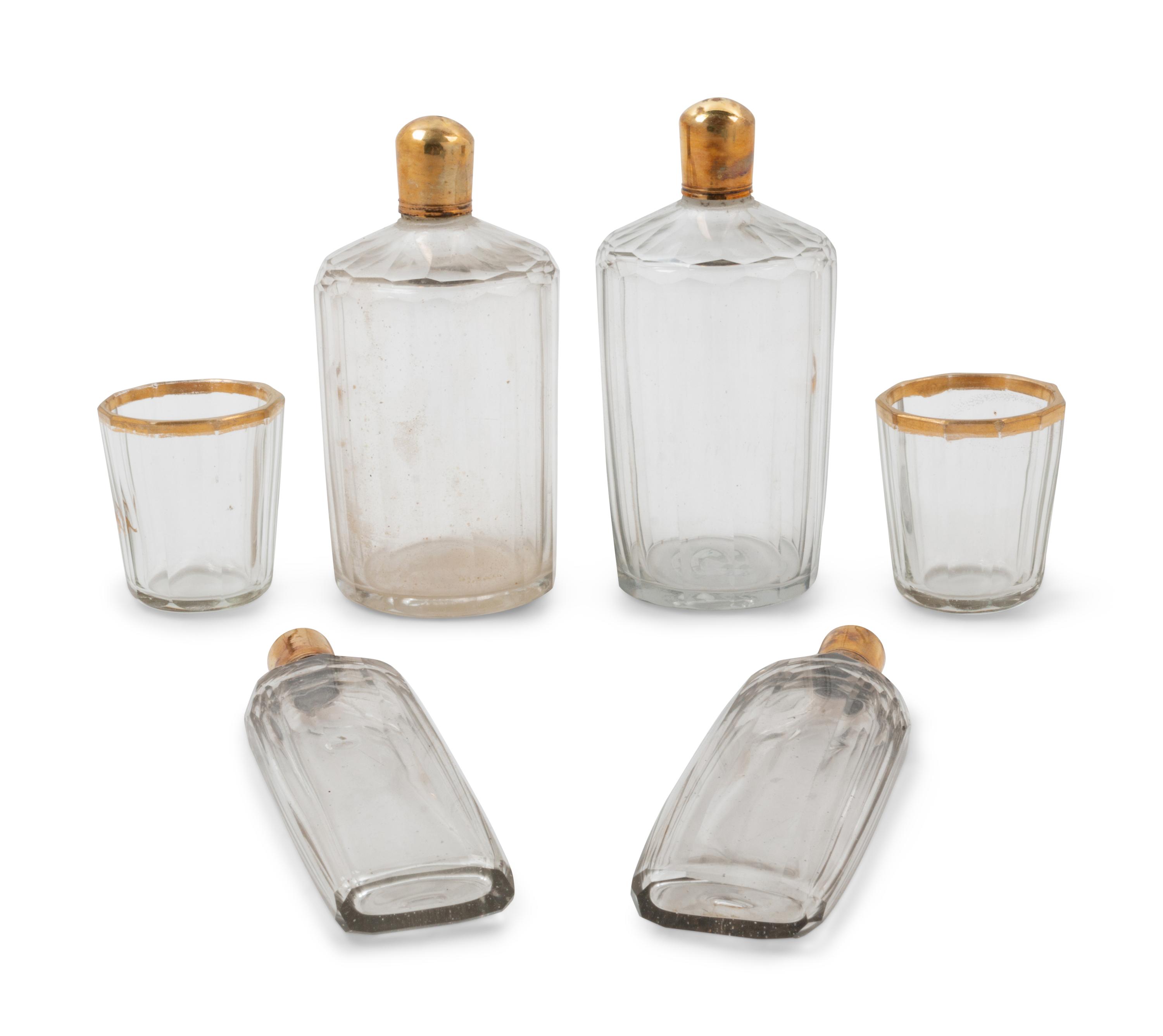 A Sèvres Painted and Parcel Gilt Porcelain Tea and Cordial Service in a Fitted Kingwood and Parquetry Traveling Case