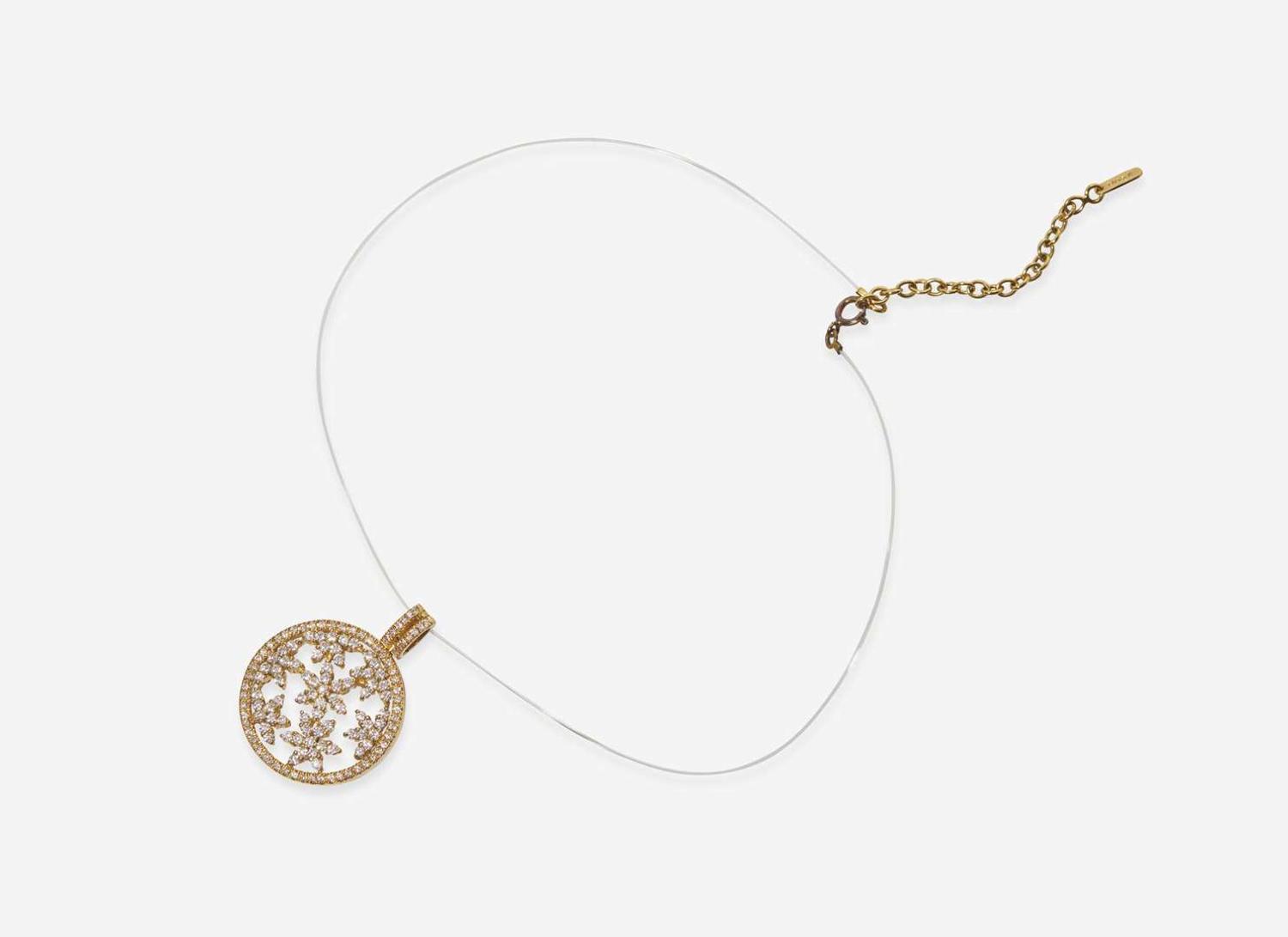 An 18K Yellow Gold and Diamond Pendant on a Lalique Cord