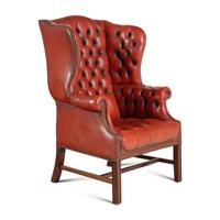 An English Button-Tufted Leather Wingback Chair and Associated Ottoman