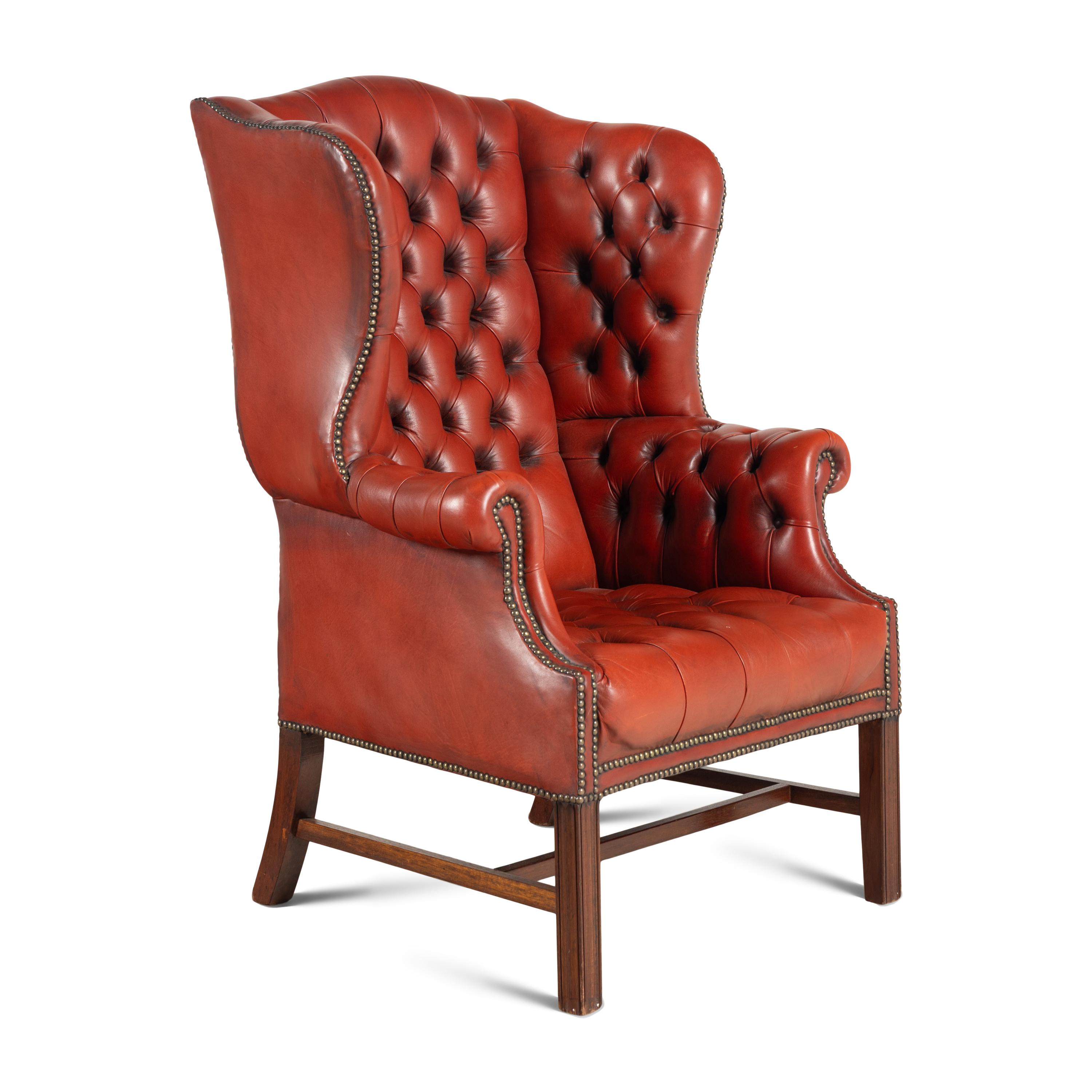 An English Button-Tufted Leather Wingback Chair and Associated Ottoman