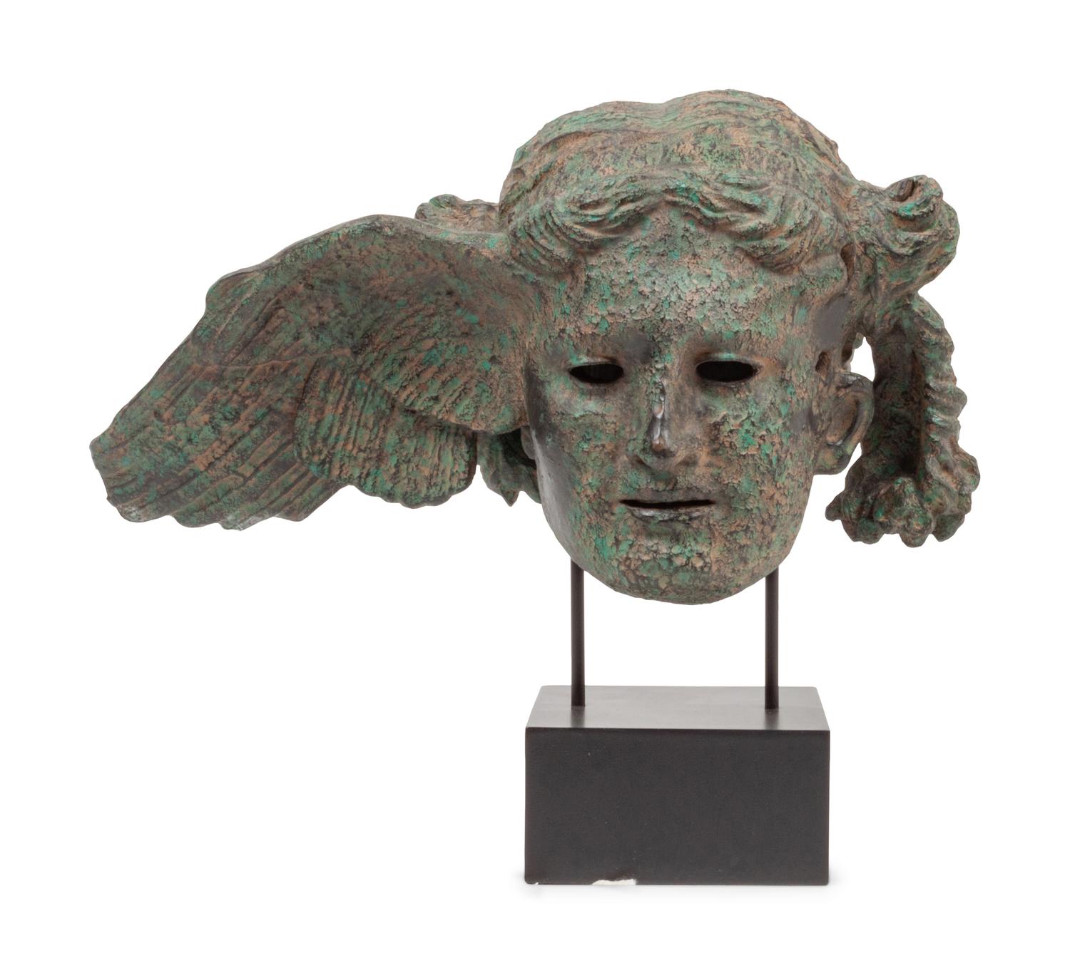 A Patinated Composition Head of Hypnos, After the Antique