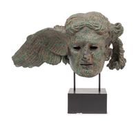 A Patinated Composition Head of Hypnos, After the Antique