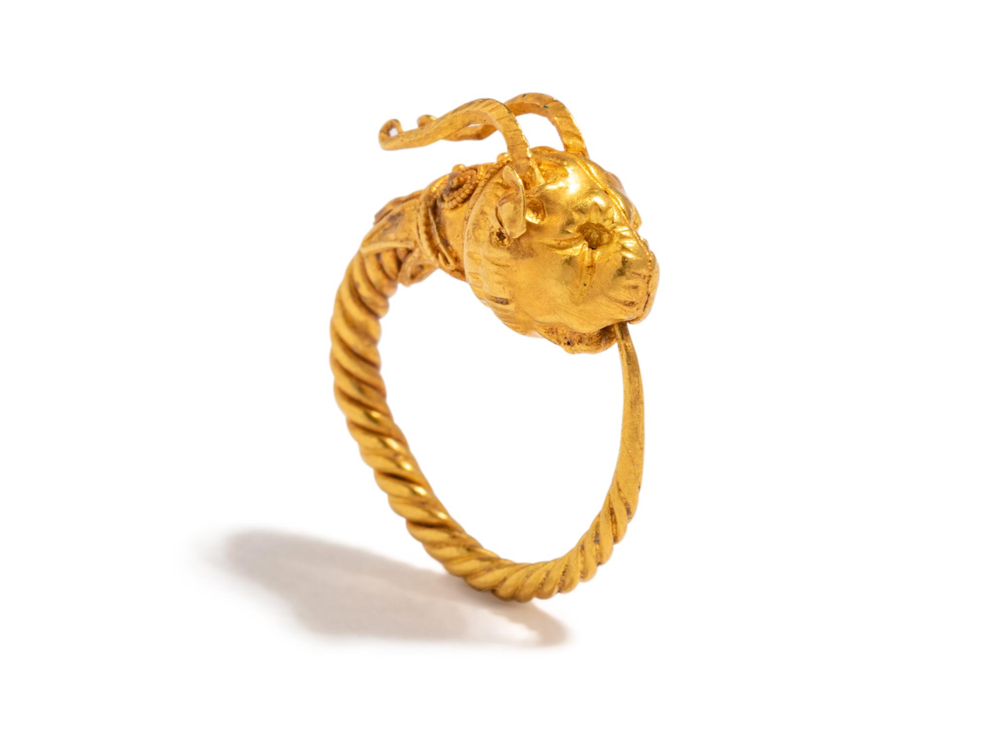A Greek Gold Hoop Earring with a Griffin-Head Terminal