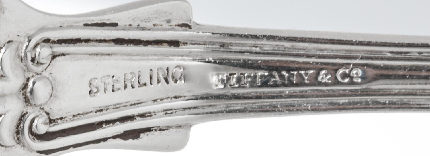 A Set of Four American Silver Tablespoons, Tiffany & Co., New York, NY, English King pattern, the handles engraved with a helmet and me