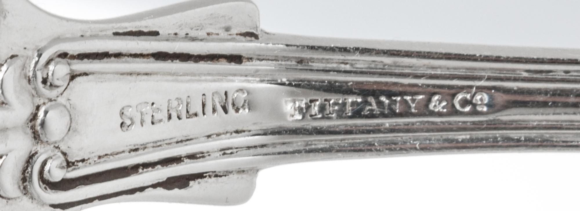 A Set of Four American Silver Tablespoons, Tiffany & Co., New York, NY, English King pattern, the handles engraved with a helmet and me