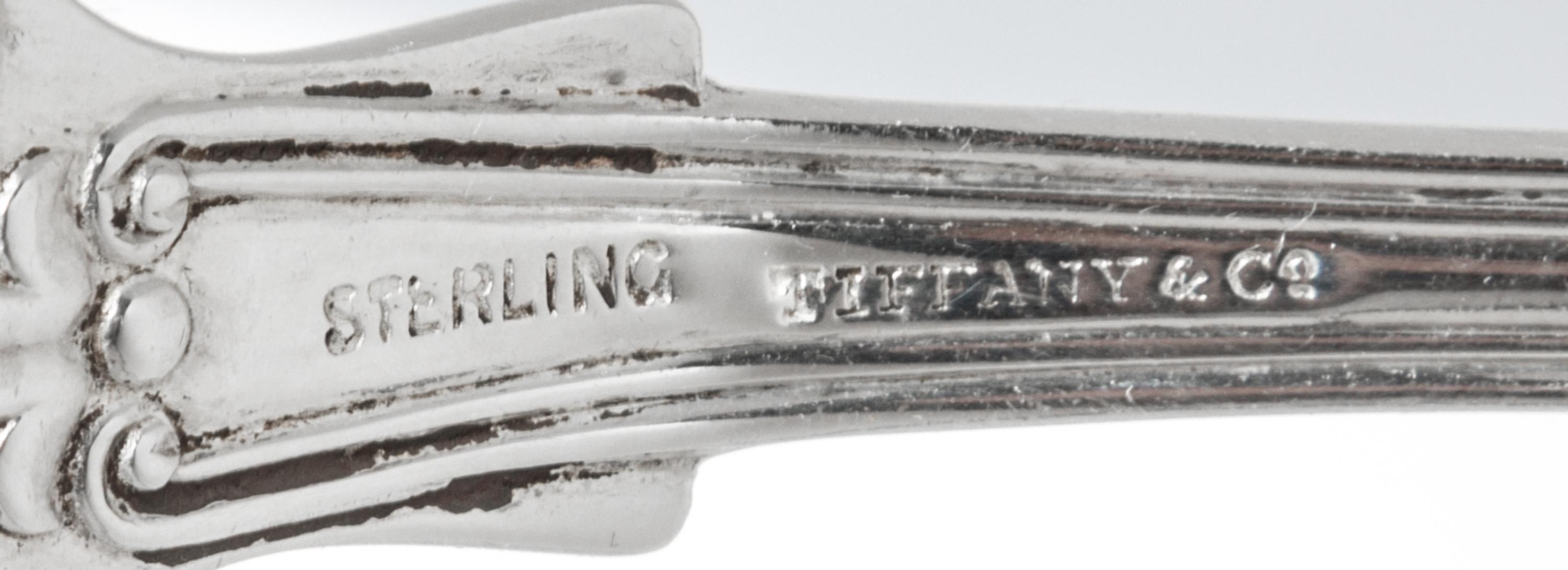 A Set of Four American Silver Tablespoons, Tiffany & Co., New York, NY, English King pattern, the handles engraved with a helmet and me