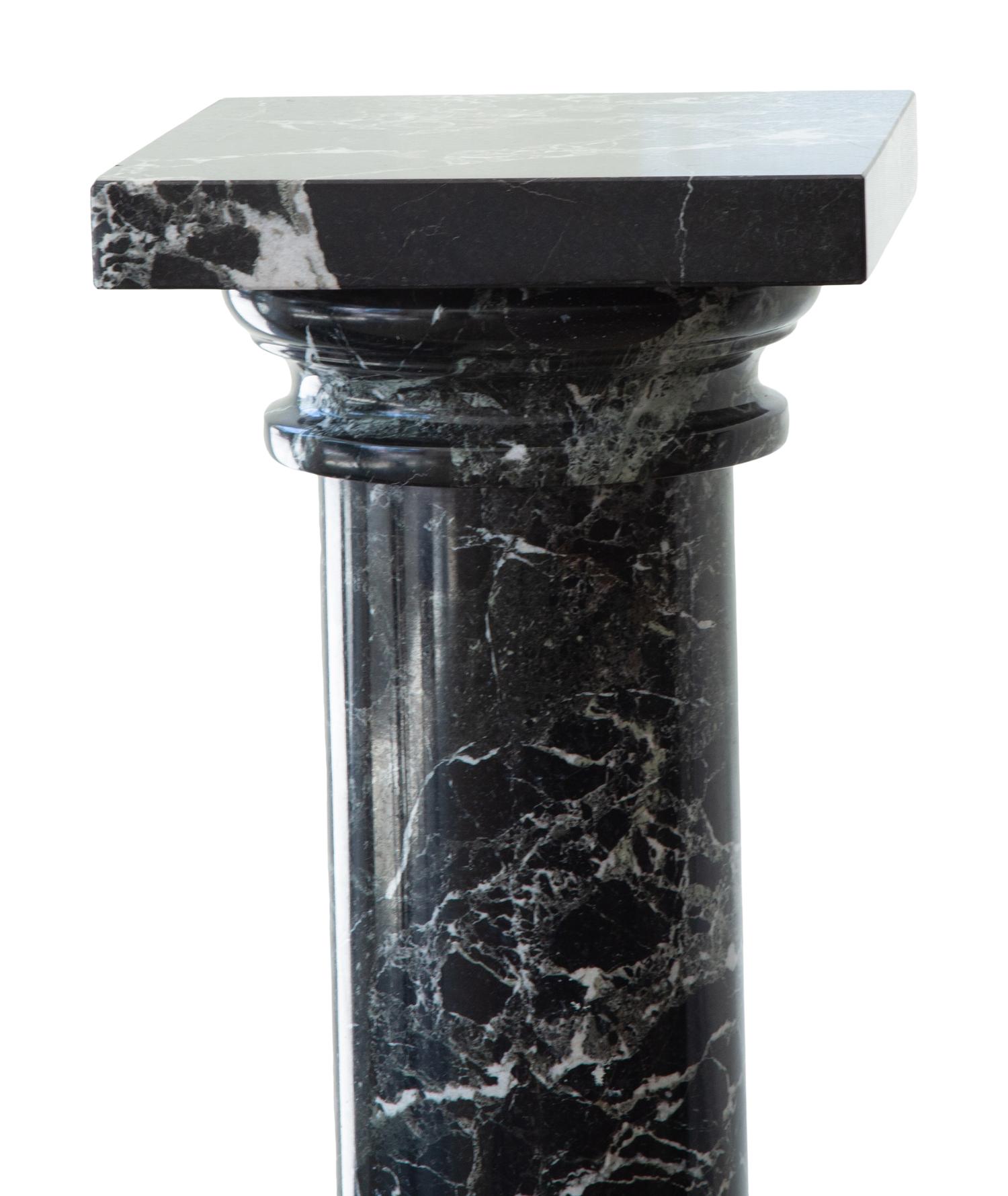 A Pair of Black Marble Pedestals