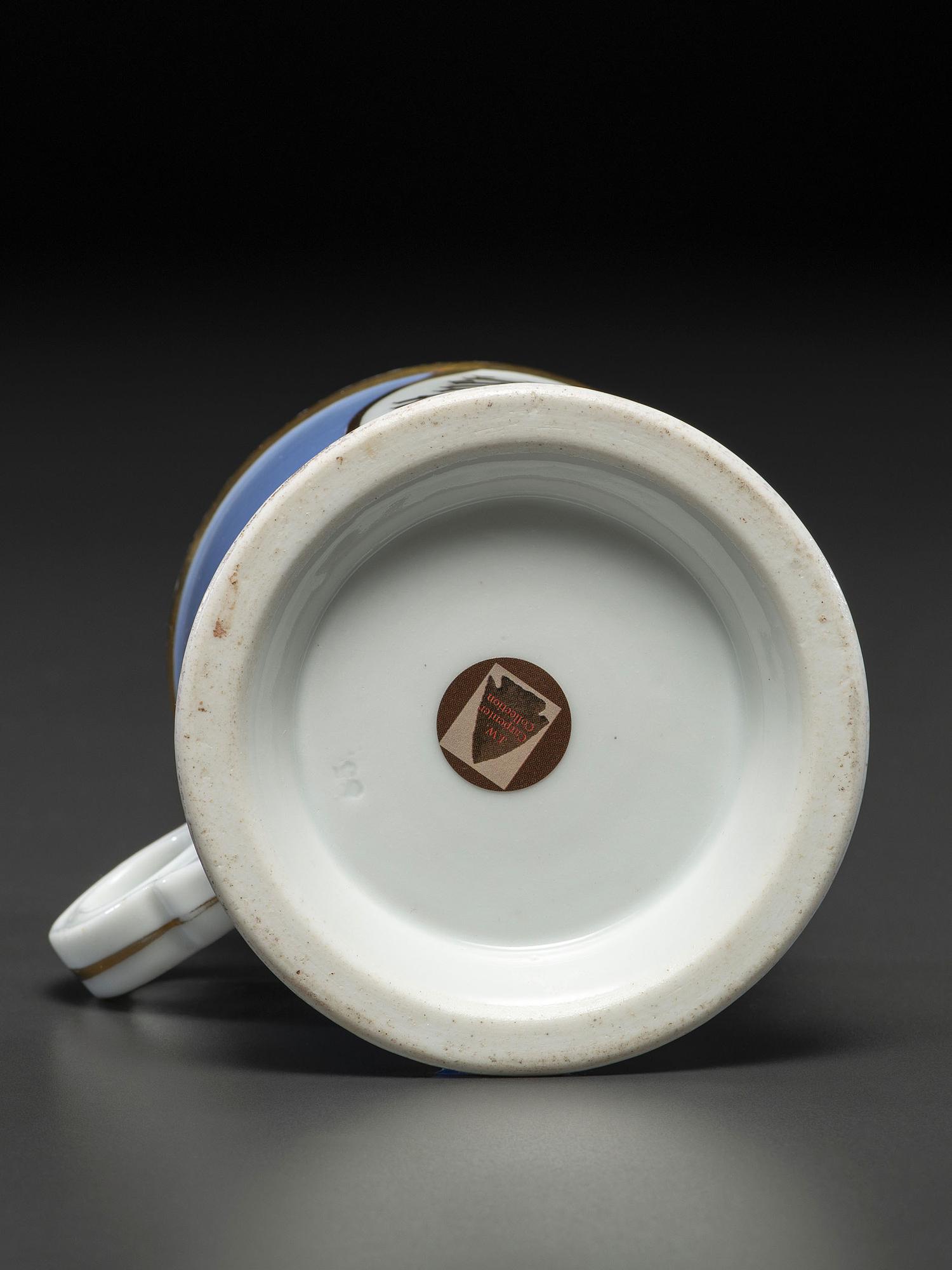 An Unusual Porcelain Shaving Mug Depicting an Icehouse