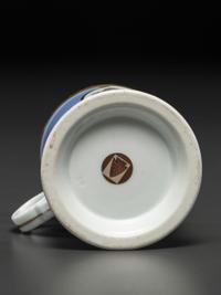 An Unusual Porcelain Shaving Mug Depicting an Icehouse
