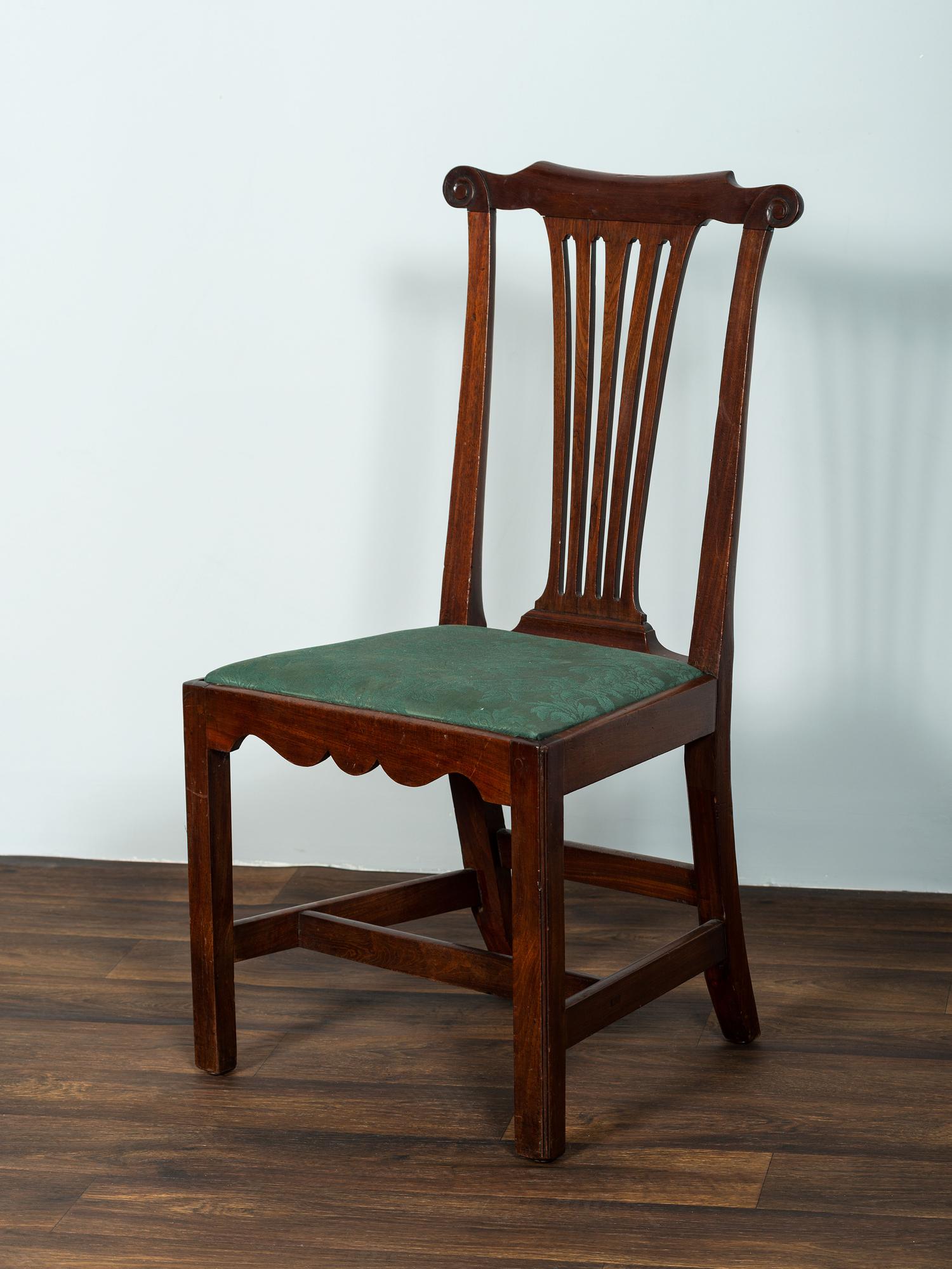 A Set of Six Chippendale Volute-Carved Mahogany Side Chairs