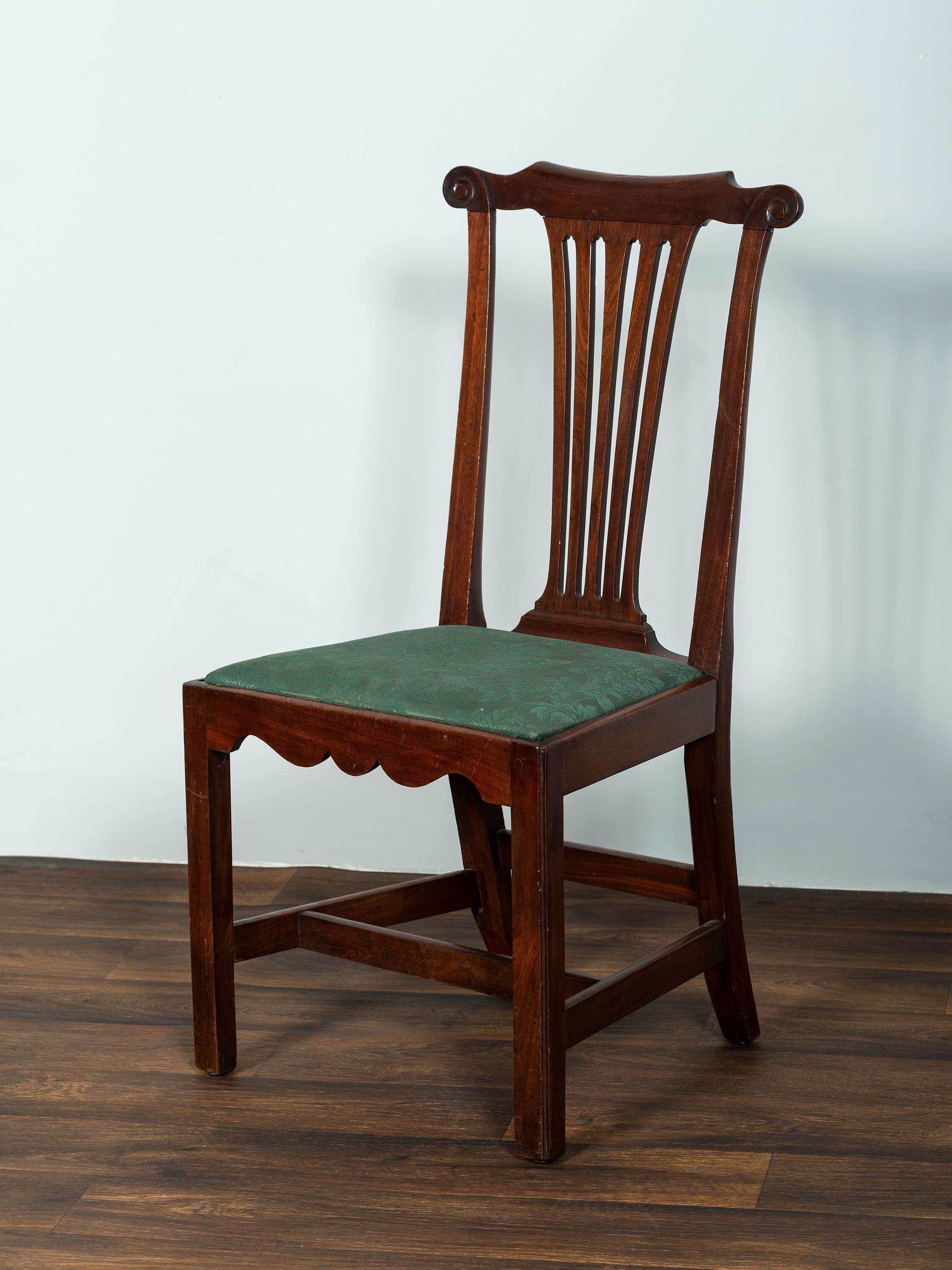 A Set of Six Chippendale Volute-Carved Mahogany Side Chairs
