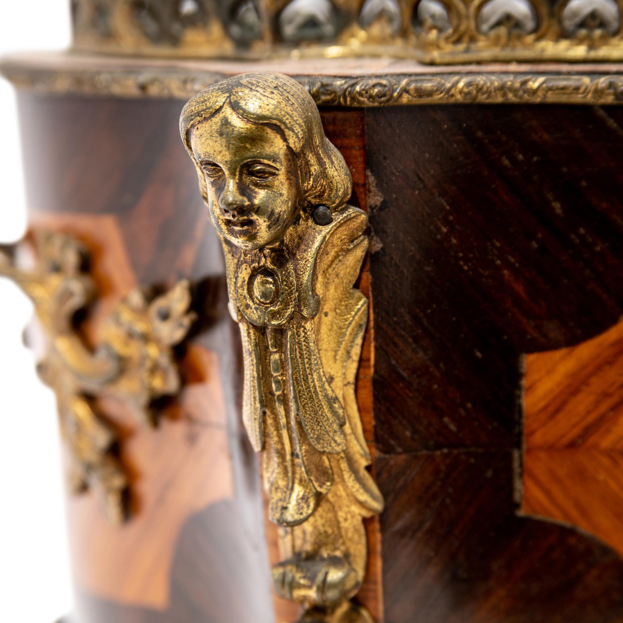 A French Porcelain and Gilt Bronze Mounted Kingwood Jardinière