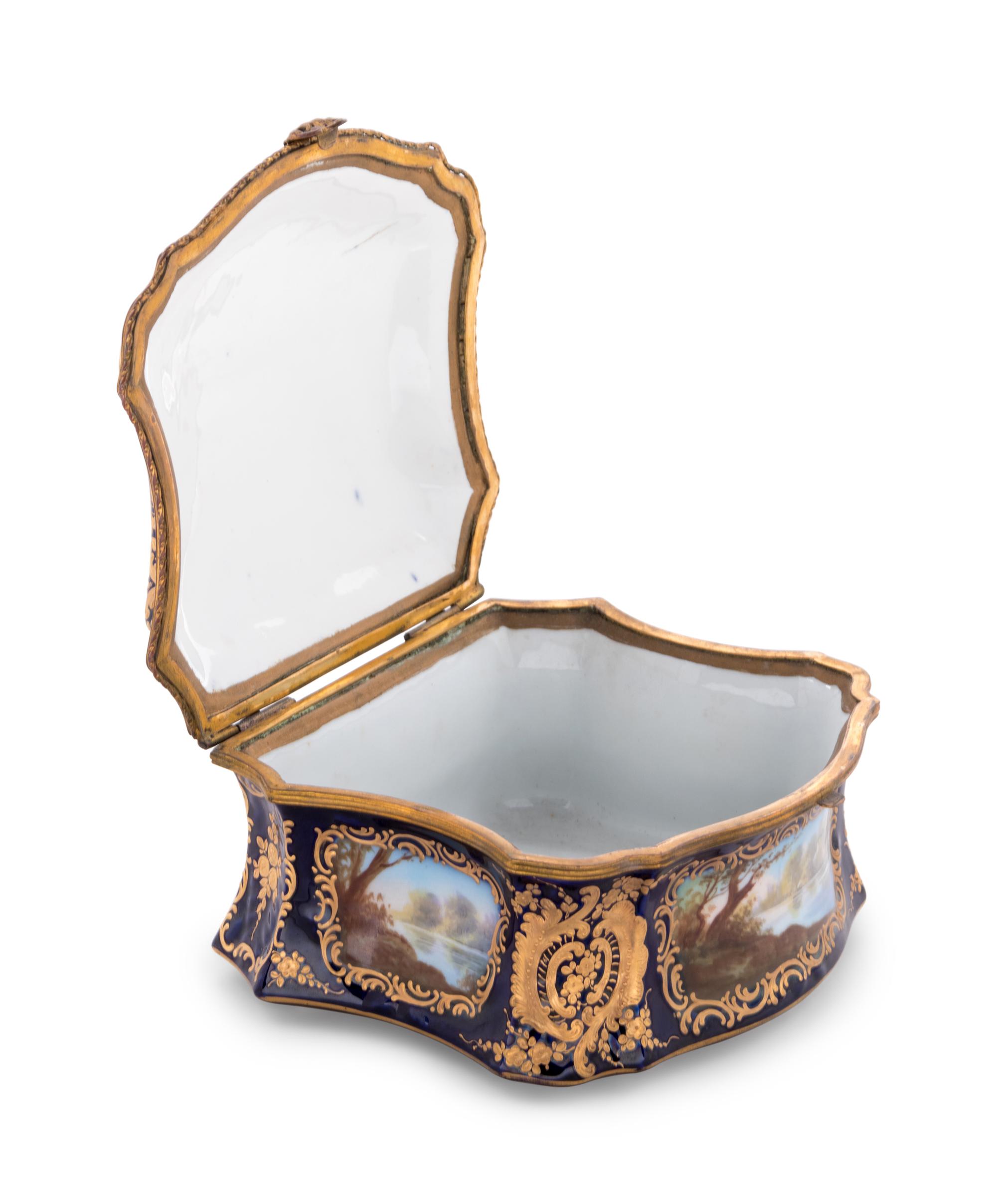A Sèvres Style Painted and Parcel Gilt Porcelain Table Casket