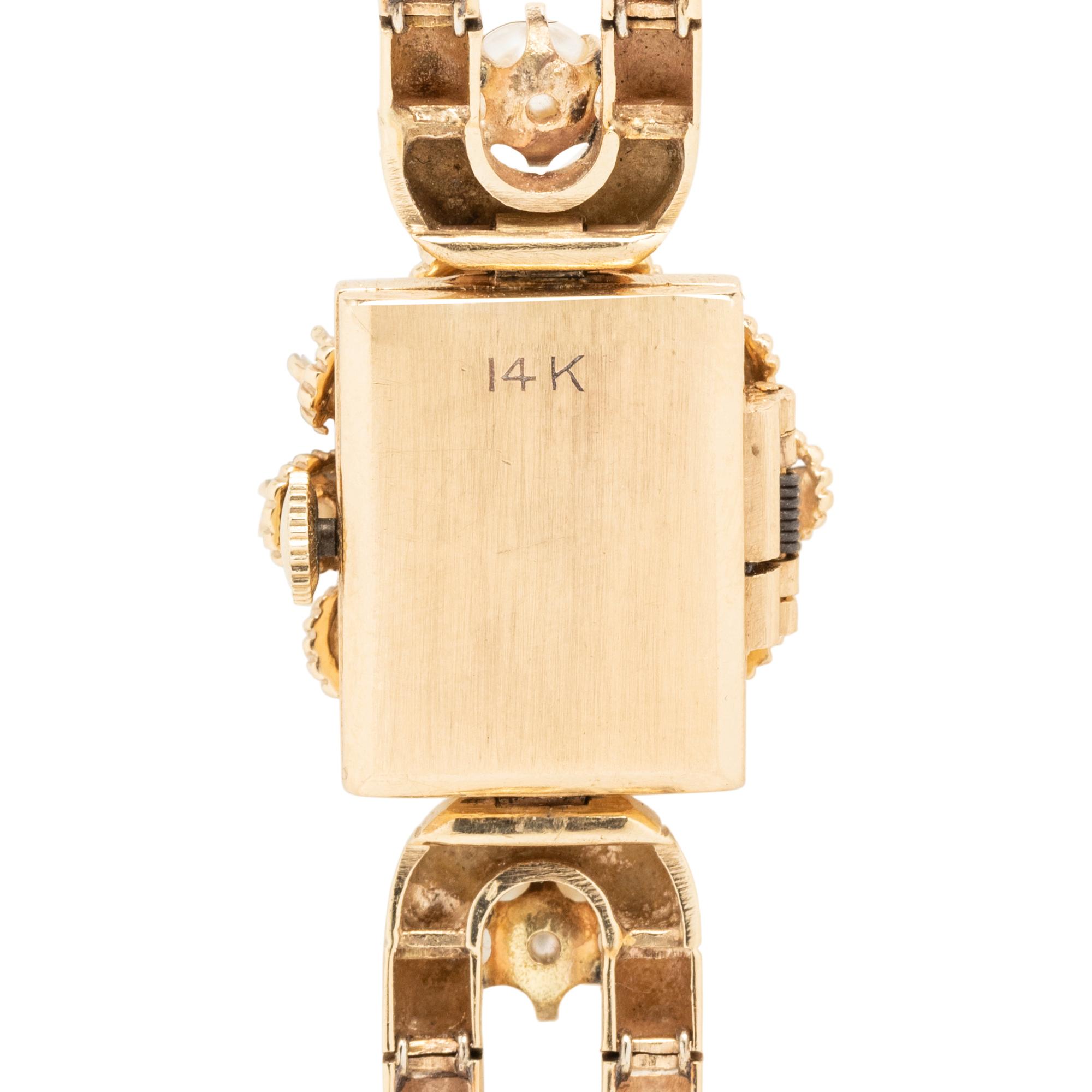 TOURNEAU, YELLOW GOLD, DIAMOND, SAPPHIRE AND CULTURED PEARL SURPRISE WATCH