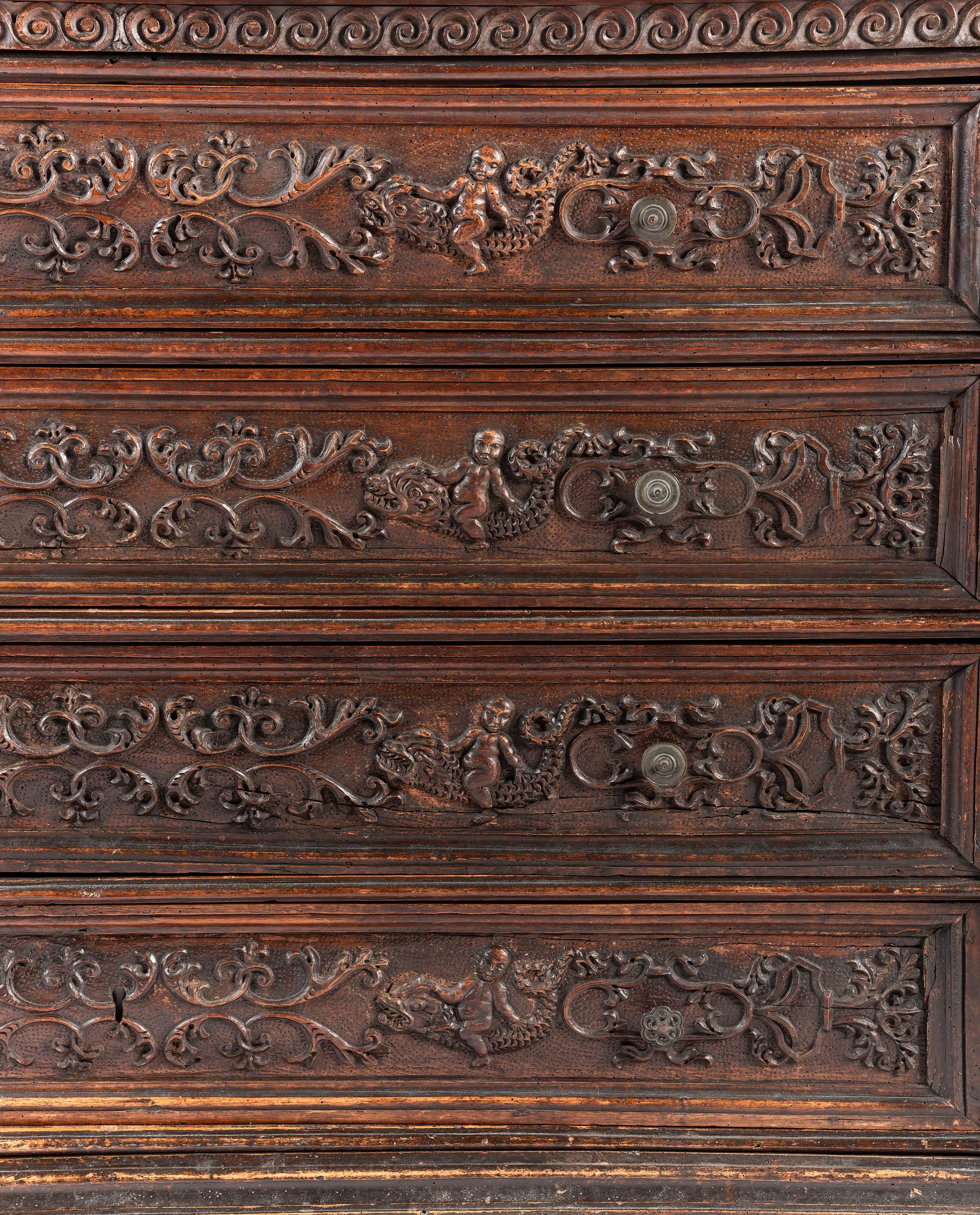 A Baroque Highly Carved Walnut Commode