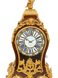 A Louis XV Gilt Bronze Mounted Kingwood Bracket Clock and Matching Wall Bracket