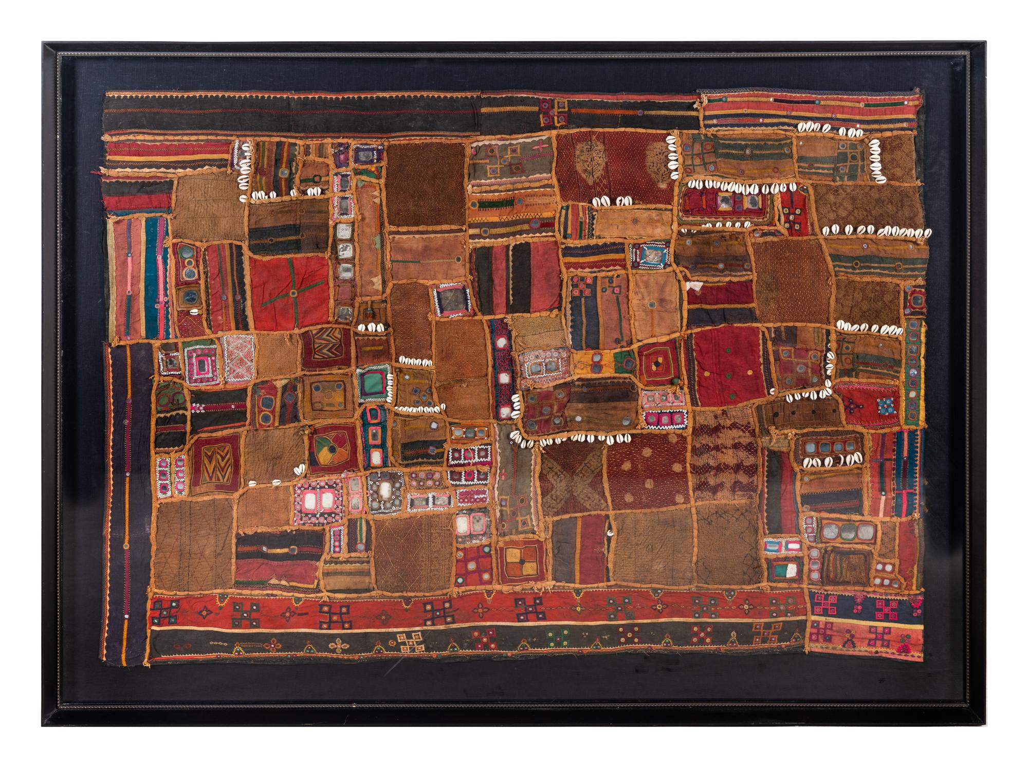 A Framed Cowrie Shell and Paillette-Applied Textile Panel