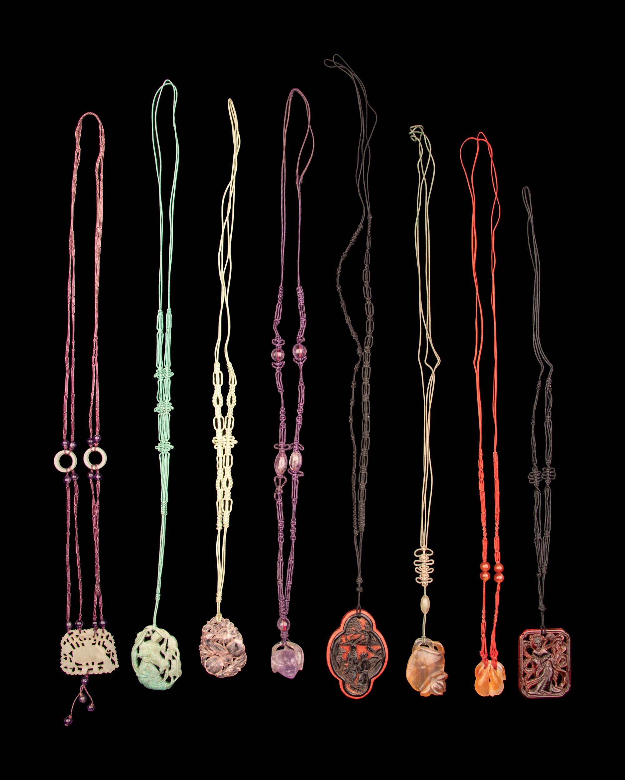 Eight Chinese Hardstone and Lacquer Pendants