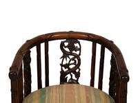 A Pair of Chinese Hongmu Horseshoe Back Carved Armchairs